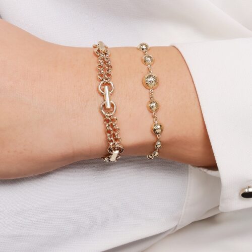 Złota bransoletka z grawerowanych płaskich kulek